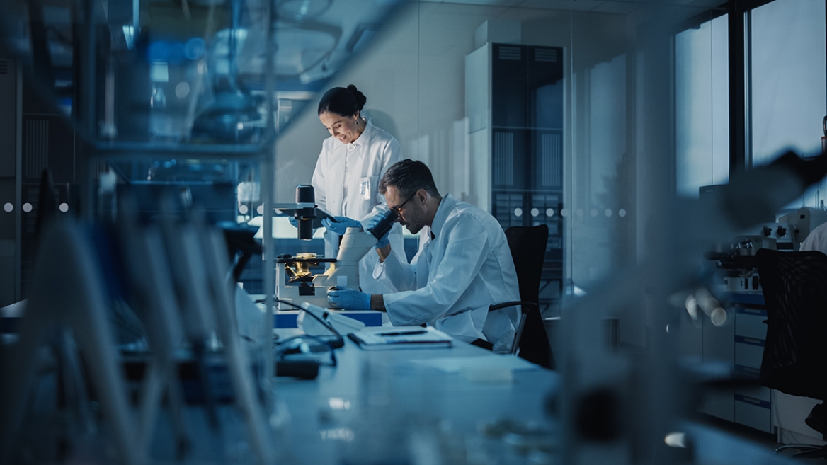 A man and a woman work in a medical research lab